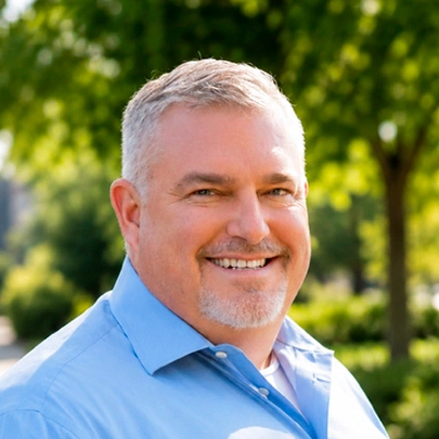 Outdoor headshot portrait of a person smiling